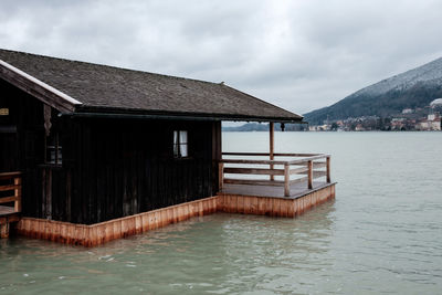 House by sea against sky