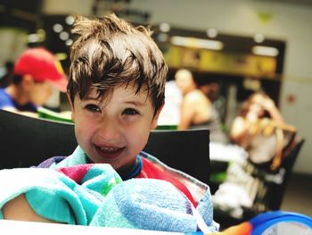 Smiling boy sitting at home