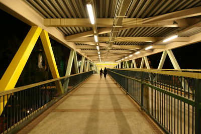 People walking on footbridge