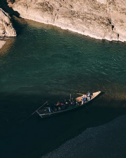 High angle view of people on boat in sea