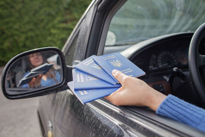 Ukrainian refugees fleeing from the war against russia. mother shows passports at the boarder