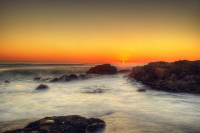 Scenic view of sea against sky during sunset