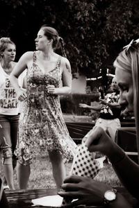 Rear view of people holding ice cream