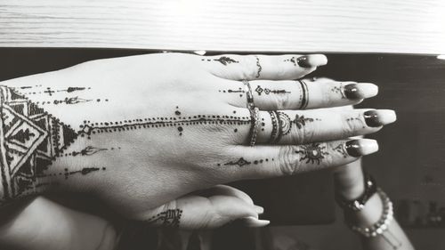 Cropped image of woman with henna tattoo