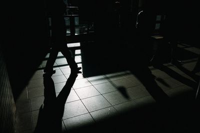 Shadow of people on tiled floor