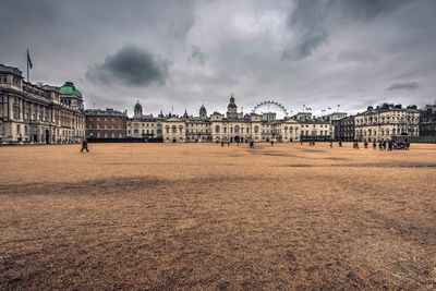 View of buildings against cloudy sky