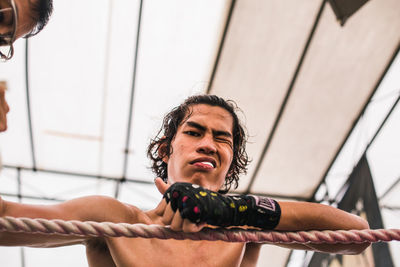Low angle portrait of boxer standing in ring