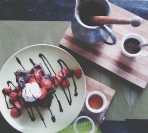 High angle view of fruits in plate on table