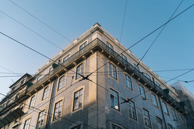 Low angle view of building against clear blue sky