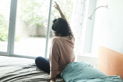 Young woman listening to music