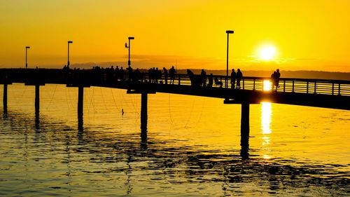 Silhouette of pier at sunset