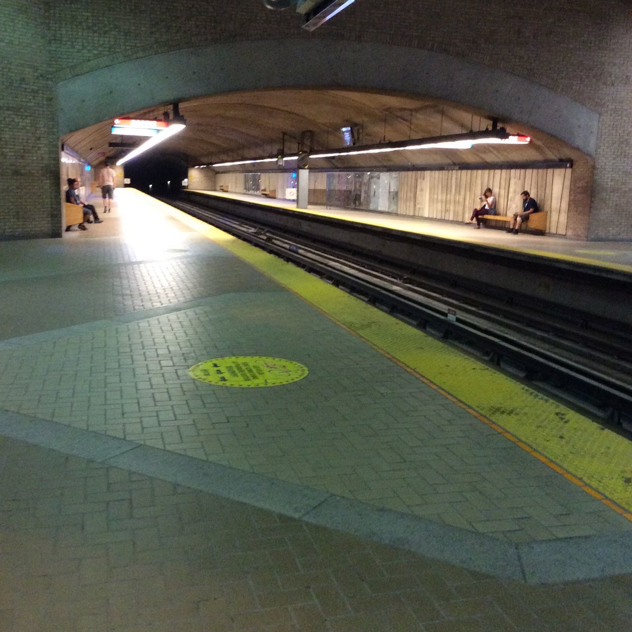 transportation, railroad station platform, railroad station, public transportation, rail transportation, railroad track, mode of transport, men, built structure, travel, architecture, illuminated, the way forward, subway station, incidental people, train - vehicle, on the move, lifestyles, person