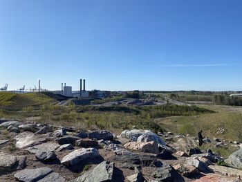 Scenic view of field against clear blue sky