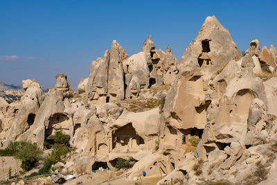 Low angle view of rock formation against sky