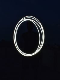 Close-up of illuminated lamp against black background