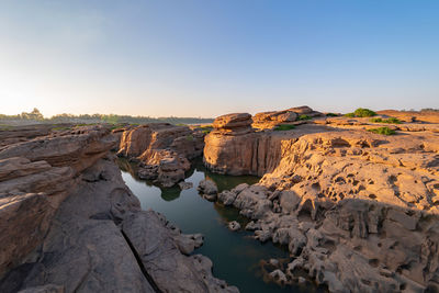 Panoramic view of rock formations against sky