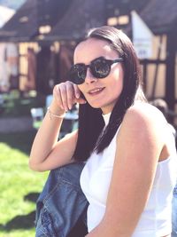 Portrait of young woman wearing sunglasses