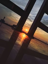 Low angle view of built structure at sunset