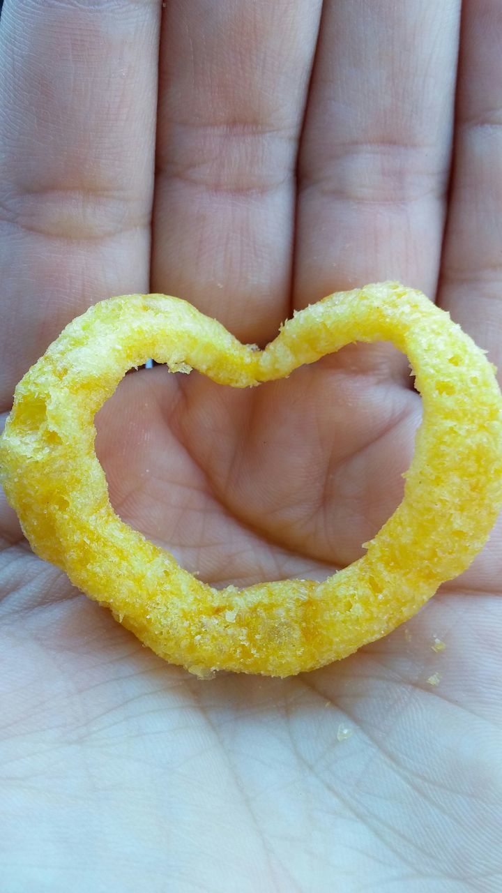 food and drink, person, food, holding, freshness, close-up, part of, fruit, human finger, healthy eating, yellow, cropped, indoors, unrecognizable person, banana, showing, high angle view