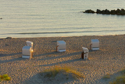 High angle view of chairs on beach