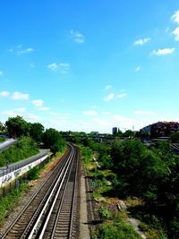 Railway tracks against blue sky