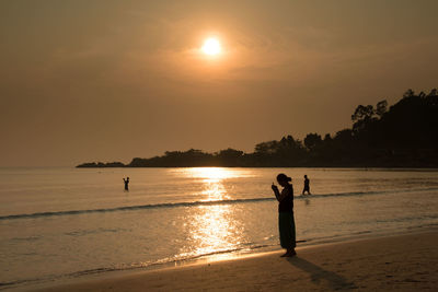 Scenic view of sea at sunset