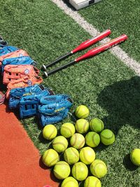 High angle view of baseball equipment at playground