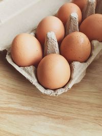 High angle view of eggs in container on table