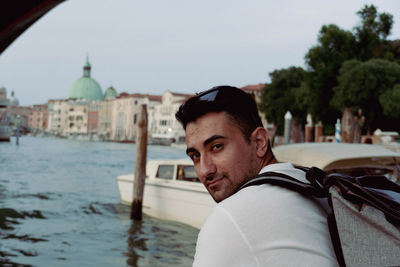 Portrait of young man in canal