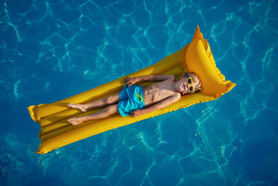 High angle view of woman swimming in pool