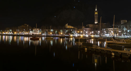 The long lake of lecco illuminated at night