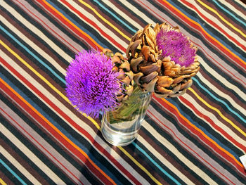 Close-up of purple flowers in vase on table