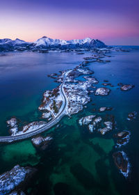 Aerial view of sea against sky during sunset