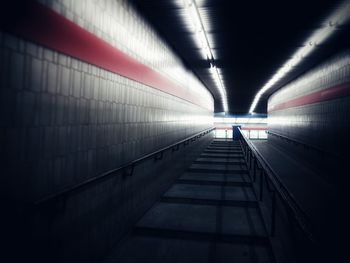 Man in illuminated tunnel