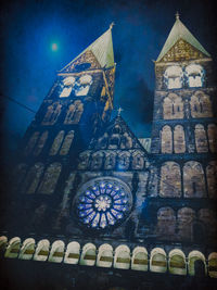 Low angle view of clock tower against building