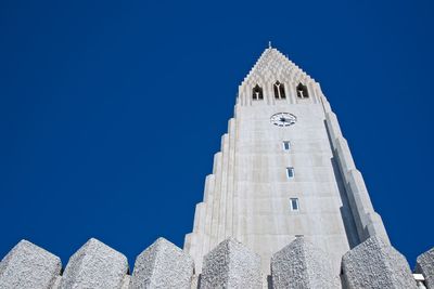 Low angle view of building against clear blue sky