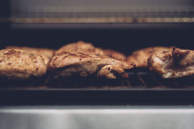 Close-up of meat on barbecue grill