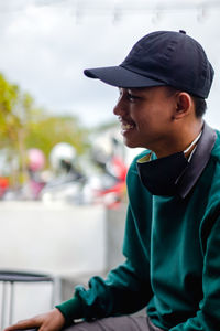 Portrait of smiling young man looking away