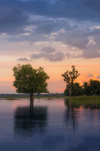 Scenic view of lake against sky during sunset