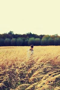 Woman standing on field