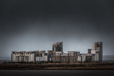 Buildings in city against sky