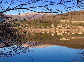 Scenic view of lake against clear blue sky