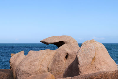 Bizarre boulders on the cote de granit rose - pink granite coast - in brittany, france