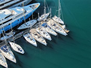 Sailboats moored on shore