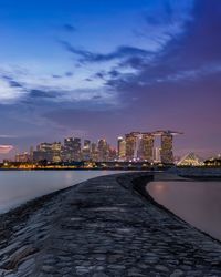 Illuminated city at sunset