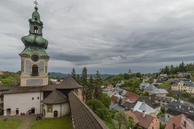 Buildings in city against sky