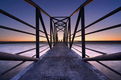 Sunrise over a pier at the sea of galilee