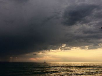 Scenic view of sea against cloudy sky