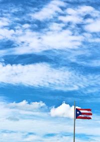 Low angle view of flag against sky