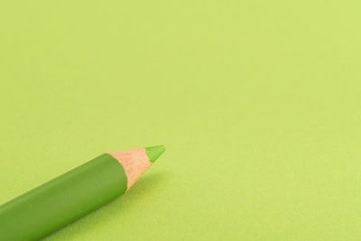 Close-up of colored pencils against white background